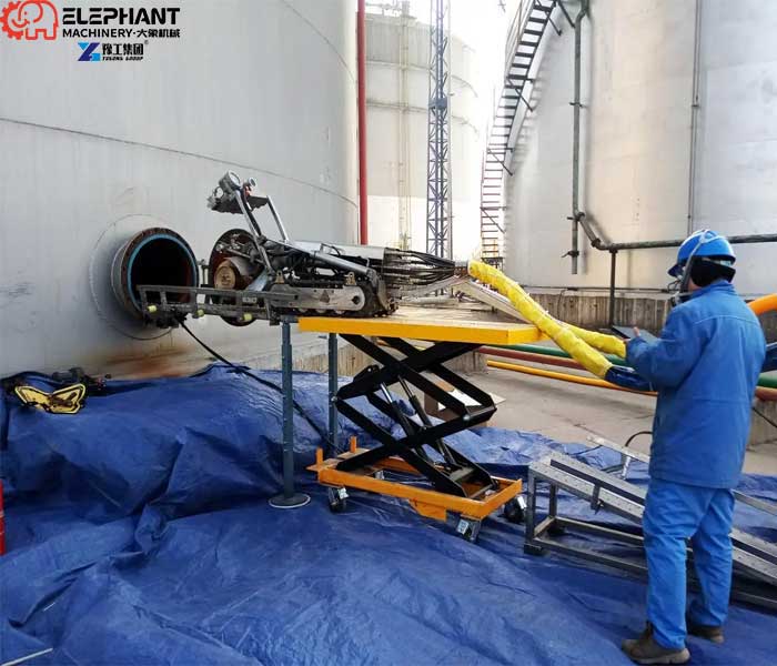 Compact oil tank cleaning robot entering confined space through narrow tank opening