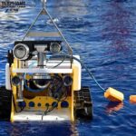 dredging robot working underwater for sediment extraction