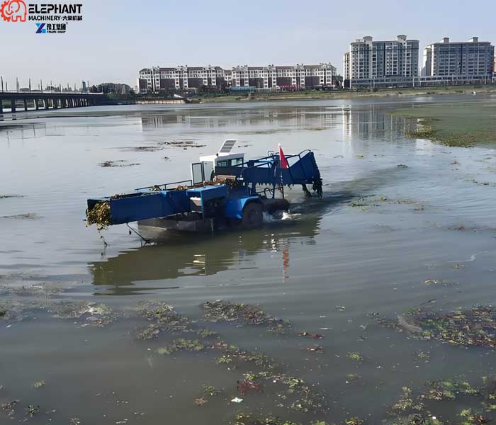 lake cleaning equipment removing floating garbage from a large water area