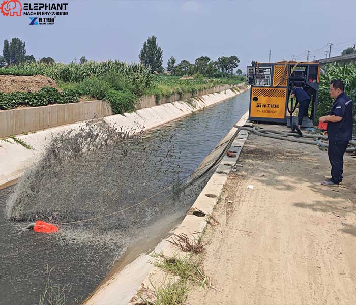 operator controlling remote controlled dredging robot with wireless remote control