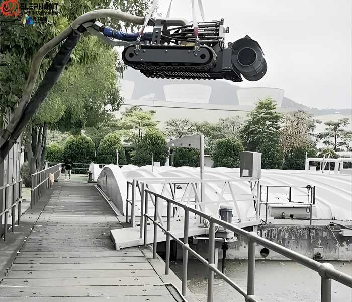 dredging robot auger system breaking thick sludge deposits in wastewater lagoon