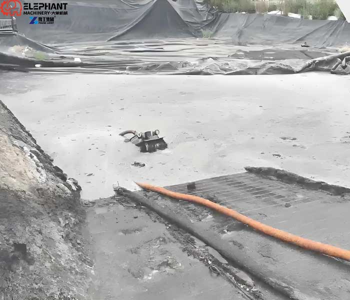 sludge cleaning robot removing sediment from livestock wastewater pond