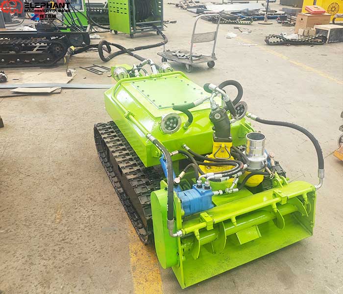 Crawler dredging robot moving through thick sludge for lagoon cleaning