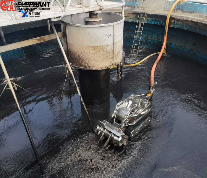 dredging robot removing sludge from tank