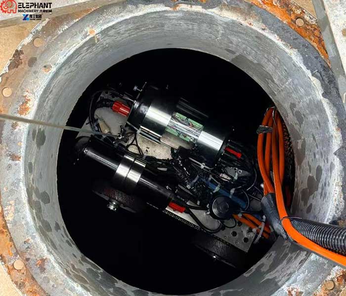 Remote-controlled tank cleaning robot operating inside an industrial tank