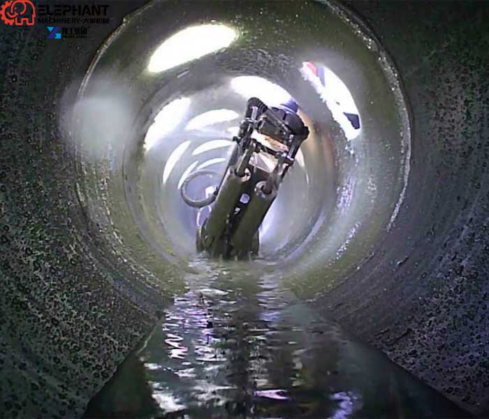 Underground pipe cleaning robot operating inside a municipal sewer pipeline