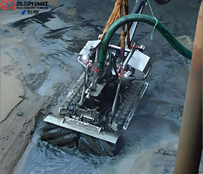 Robot-based sludge removal process inside a wastewater tank
