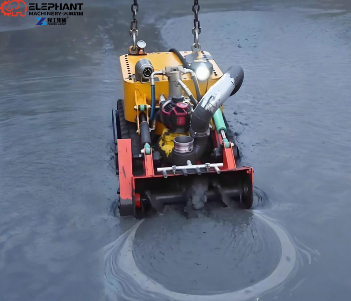 Remote-controlled robot removing sludge from a wastewater tank