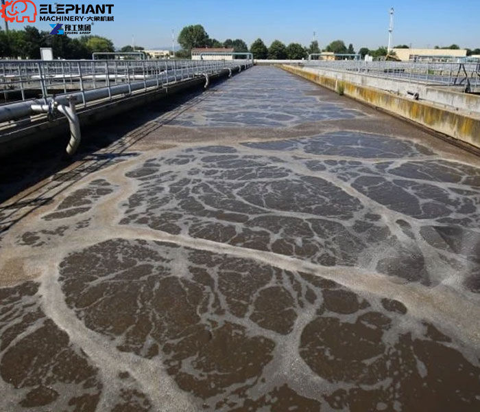 Industrial wastewater tank sludge removal with a remote-controlled robot